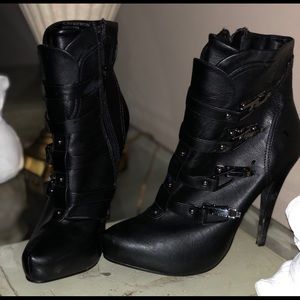 Pretty black boots  w/ metal clasps and side zip.